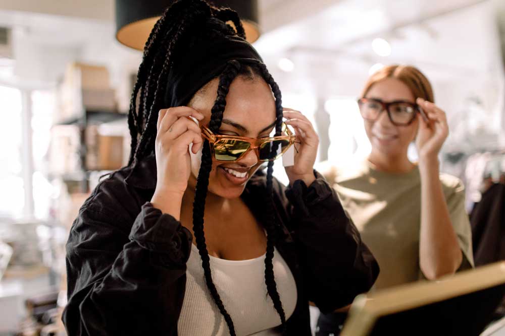 A person trying out shades.