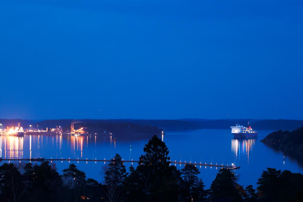 Passenger ferry arriving to port at night in Nynäshamn, Sweden.