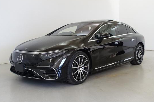 A black luxury limousine of the brand and model Mercedes Benz S.